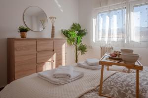 Posteľ alebo postele v izbe v ubytovaní MRS Apartamento vistas Sierra Nevada con parking