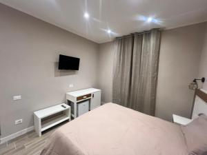TV a/nebo společenská místnost v ubytování Matera in Centro Rooms