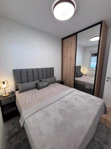 Ένα ή περισσότερα κρεβάτια σε δωμάτιο στο Bjelasnica Comfort