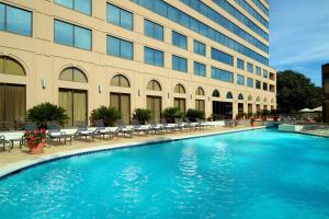 a large swimming pool in front of a building at Austin Southpark Hotel in Austin
