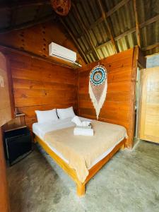 Postel nebo postele na pokoji v ubytování MAYAB Holbox