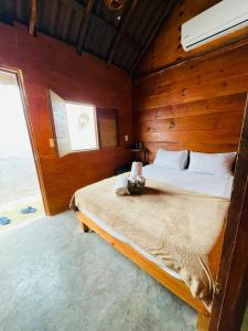 Postel nebo postele na pokoji v ubytování MAYAB Holbox
