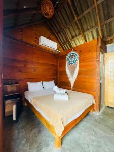 Postel nebo postele na pokoji v ubytování MAYAB Holbox