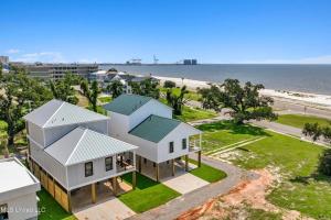 an aerial view of a house and the beach at Beach Retreat in Gulfport