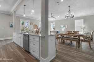 a kitchen and dining room with a dining table at Beach Retreat in Gulfport