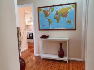 a map of the world hanging on a wall at Ronelle Cottage in Berrima
