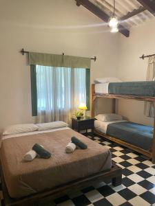 Postel nebo postele na pokoji v ubytování Madreselva Hostel