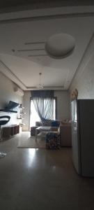 a living room with a couch and a bed at Cozy 1BR 1BA Retreat in Casablanca