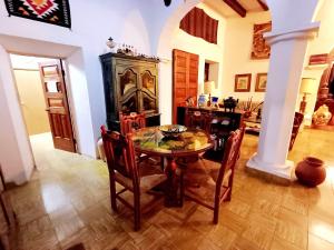 a dining room with a table and chairs at Casa Serena Vista in Álamos