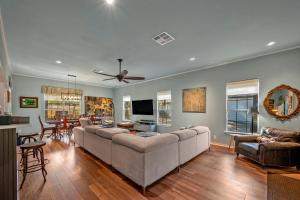 a living room with a couch and a dining room at Entire Home! Fantastic Kitchen! 3 Full Baths in Mead
