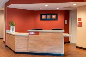 a hello reception counter in a hospital lobby at TownePlace Suites by Marriott Louisville North in Jeffersonville +15 photos