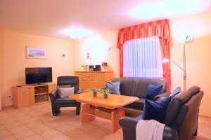 TV a/nebo společenská místnost v ubytování Ferienhaus Gudrun