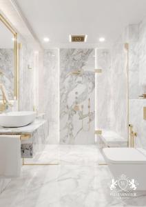 a bathroom with a sink and a tub and a toilet at Westminster Dubai Mall in Dubai