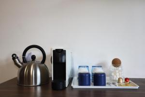 Příslušenství pro přípravu čaje a kávy v ubytování NOVA House T2 + 9 fotografií
