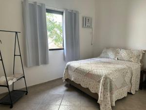 Ένα ή περισσότερα κρεβάτια σε δωμάτιο στο Casa Valen com 2 quartos
