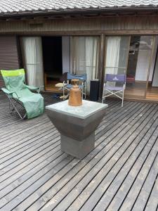 a patio with chairs and a fountain on a deck at OUR HOUSE-Mie in Nishiki +29 photos
