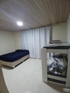 Katil atau katil-katil dalam bilik di Rosemary Hospedagem