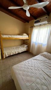 Postelja oz. postelje v sobi nastanitve Casa para 10 personas a 6 cuadras de la playa principal