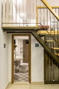 a bathroom with a staircase and a toilet at Seashine Apartment in Da Nang +86 photos