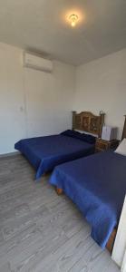 Postel nebo postele na pokoji v ubytování Casita Angel Del Mar