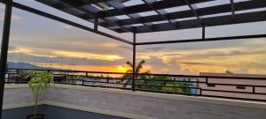 a view of the sunset from the balcony of a building at Addvantage Point Apartments in Montego Bay