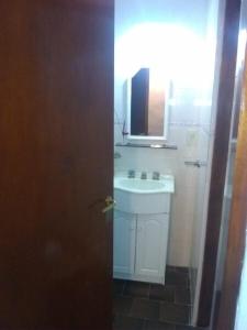 a bathroom with a sink and a mirror at Duplex a 500m de la playa in Villa Gesell
