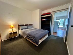 A bed or beds in a room at Nestled on Tower Hill's edge, with stunning views!