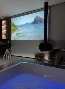a large tub in a room with a view of the ocean at Sombra na Montanha in Nova Petrópolis