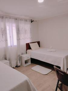 Ένα ή περισσότερα κρεβάτια σε δωμάτιο στο Hotel Victoria +34 φωτογραφίες