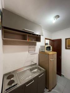 Kuchyň nebo kuchyňský kout v ubytování Recanto Casa de Pedrinha - Aptos para temporada e finais de semana + 28 fotografií