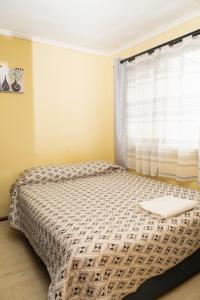 Voodi või voodid majutusasutuse Hostal Del Tuto toas