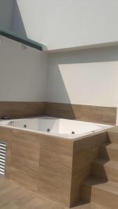 a bathroom with a bath tub in a room at Suite For You - Salinas Chipipe in Salinas +39 photos