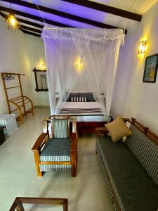 Postel nebo postele na pokoji v ubytování Cozy Homestay Waterfall Road Ella