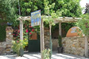a building with a sign in front of it at Apartamentos Turisticos Trajano in Bolonia