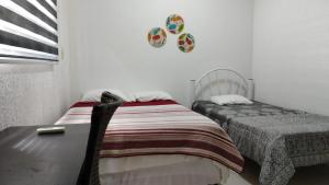 Postel nebo postele na pokoji v ubytování Stefanich Aparthotel 51