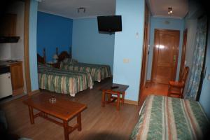 Postel nebo postele na pokoji v ubytování Hotel Las Nieves