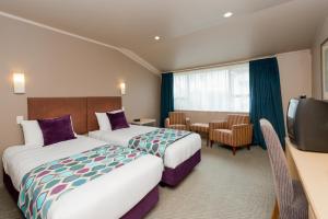Ліжко або ліжка в номері Heartland Hotel Fox Glacier