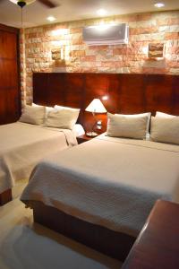 Postel nebo postele na pokoji v ubytování El Zaguán Colonial by GuruHotel