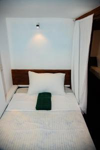 Postel nebo postele na pokoji v ubytování New Radiant Hostal