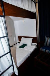 Postel nebo postele na pokoji v ubytování New Radiant Hostal