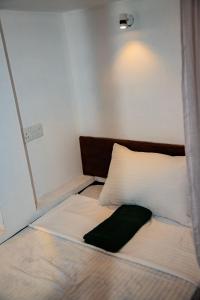 Postel nebo postele na pokoji v ubytování New Radiant Hostal