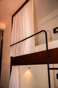 Postel nebo postele na pokoji v ubytování New Radiant Hostal