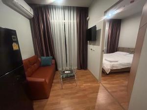 Postel nebo postele na pokoji v ubytování The Grand Jomtien Condo