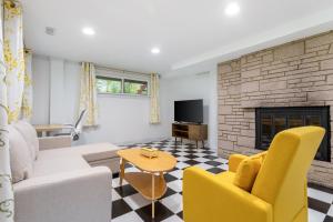 a living room with a couch and a fireplace at Family friendly house with MIL suite in Sammamish