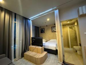 Postel nebo postele na pokoji v ubytování The Grand Jomtien Condo