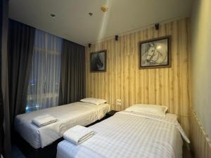 Postel nebo postele na pokoji v ubytování The Grand Jomtien Condo