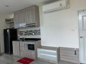 Kuchyň nebo kuchyňský kout v ubytování The Grand Jomtien Condo