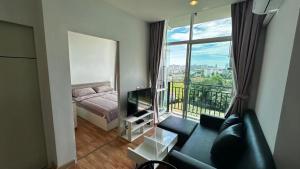 Postel nebo postele na pokoji v ubytování The Grand Jomtien Condo