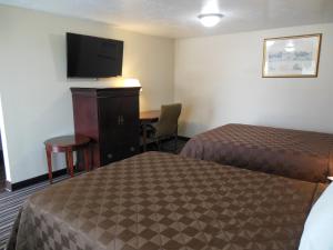Postel nebo postele na pokoji v ubytování Route 66 Inn