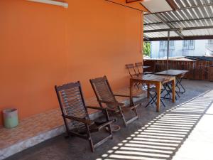 a table and chairs sitting on a patio at Punnpannsuk in Trat